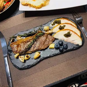 Irregular bamboo-tip shaped black slate dinner plate for western steak, BBQ, and desserts.