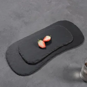 Black irregular natural slate dinner plate serving tray for steak, dessert and western food display