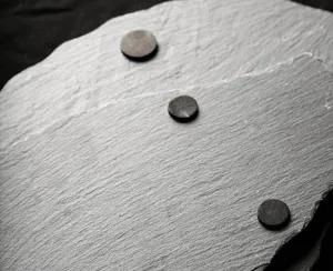 Natural slate plate detail showing rough stone texture for food presentation and table decor.