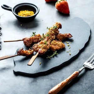 Black leaf shaped natural slate serving plate for steak sushi and restaurant food presentation main