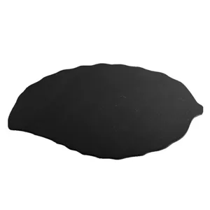 Leaf shaped black slate plate for steak sushi serving tray and dining table presentation.