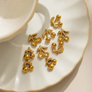Gold cherry charm pendants for DIY jewelry making, cute heart and round fruit accessories.