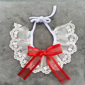 White lace pet collar with a large red bow, cute cat and dog bib accessory for daily dress.