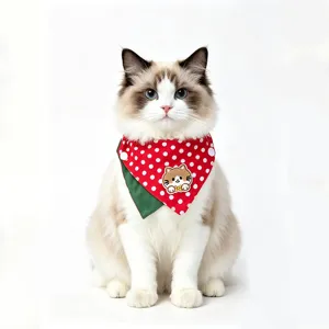 Detail of cute red polka dot pet bandana with cute cat embroidery patch for cats and dogs.