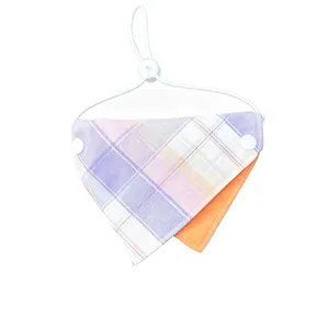 Detailed view of double-sided pet bandana with cute plaid pattern and adjustable cord for cats.
