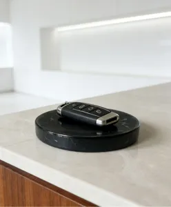 Detail shot of a black round natural marble soap dish tray, elegant and minimalist design.