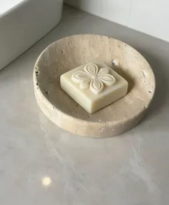 Natural stone soap dish detail shot, minimalist travertine marble bathroom tray and soap.
