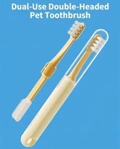 Dual-headed pet toothbrush detail showing soft bristles and silicone cleaning head with clear case