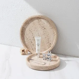 Natural travertine round tray for home decor, elegant stone storage plate for desktop organization.