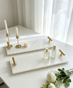 Luxurious white marble tray with gold handles, elegant rectangular serving tray for home decor.