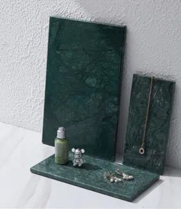 Modern natural dark green marble photography display prop tray for cosmetics and jewelry styling.