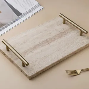 Natural travertine stone serving tray with luxury gold metal handles for home decor storage.