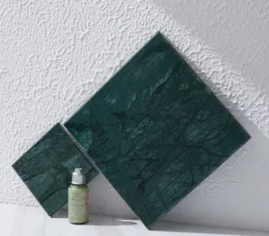 Close-up detail of the modern natural green marble display plate, perfect photography prop.