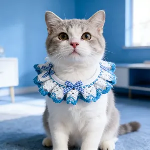 Close-up detail of blue and white crochet pet collar featuring cute checkered bows for cats.