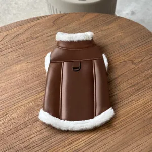 Detail shot of a brown leather pet vest with white fleece lining, warm winter dog clothes.