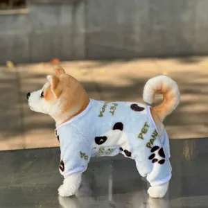 Detailed view of the cute flannel four-leg pet clothes with panda prints and soft fabric.
