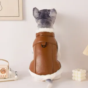 Detailed shot of pet winter leather vest with fleece lining, cozy brown apparel for small dogs.