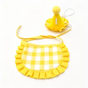 Cute yellow pet birthday hat and bib set with grid pattern for dogs and cats party celebration.