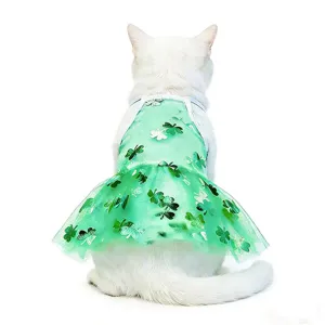 Close-up detail of a cute green mesh pet dress with clover pattern, worn by a white cat.