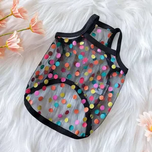 Close-up detail of a sheer black pet mesh vest featuring colorful polka dots and trim.