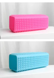 Silicone pet hair removal brush for cats and dogs, reusable cleaning tool in pink and blue.