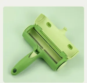 Green pet hair remover detail, efficient brush for cat and dog fur on clothes and beds.