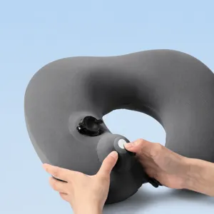 Inflatable U-shaped travel neck pillow with fast press inflation for comfortable flights.