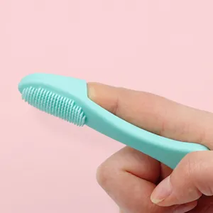 Silicone pet finger toothbrush for cats and dogs, soft cleaning tool for pet black chin.