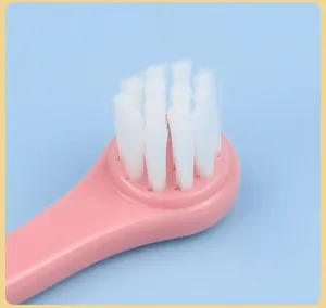 Soft bristle pet toothbrush detail view, perfect for cat and dog oral care and teeth cleaning.