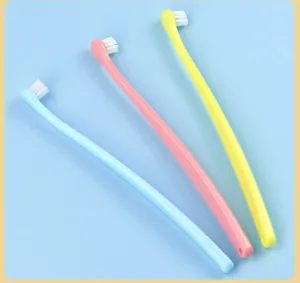 Detailed view of colorful pet toothbrushes with soft bristles and comfortable long handle.