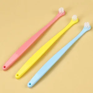 Ergonomic pet toothbrush set with 4-degree curved long handle and soft bristles for clean oral care.