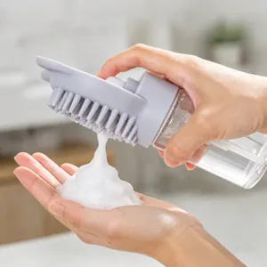 Pet bath massage brush with soap dispenser, silicone grooming tool for dogs and cats.