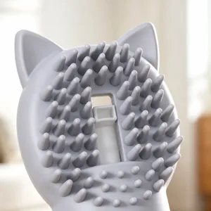 Silicone pet bath brush with soft cat ear design for gentle massage and grooming.