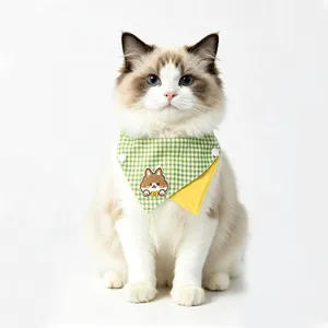 Cute green plaid pet bib detail showing cute animal embroidery and double-sided wearable design.