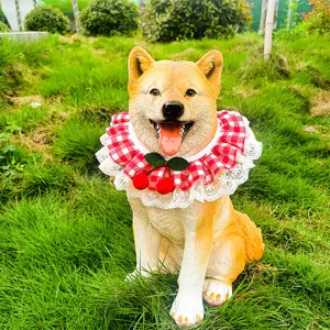 Cute red white checkered pet bib with lace trim and cherry decoration for cats and dogs detail.