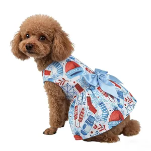 Close-up detail of the Christmas pet dress with blue bow and festive print for cats and dogs.