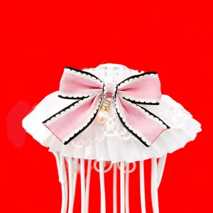 French lace pet collar detail featuring a sweet pink bow and elegant pearl pendant design.