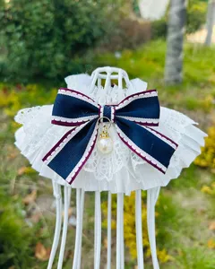 French lace pet bib with navy bow and pearl pendant detail for cats and dogs
