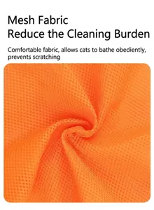 Detailed macro close-up of orange mesh fabric material used for breathable pet cat washing bags.