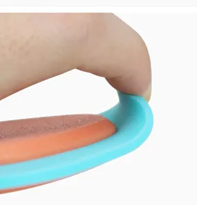 Pet hair remover detail brush with flexible blue frame and orange abrasive surface.