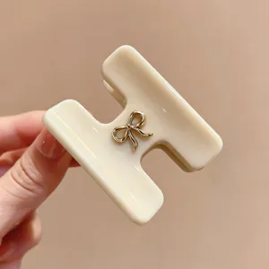 Molletta per capelli H in acetato stile coreano minimal con fiocco dorato per acconciatura.