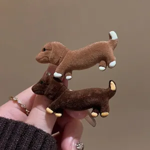 Close up of cute brown dachshund velvet hair clip, soft texture and exquisite workmanship.