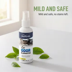 Close-up detail shot of car odor eliminator spray bottle with fresh green tea leaves.