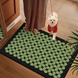 Detailed view of the black and green patterned floor mat in a cozy home setting with a pet.