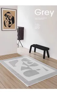 Modern abstract geometric grey and white carpet for living room and bedroom floor decor.