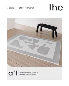 Detailed view of the grey and white abstract geometric pattern rug, perfect for modern living room.