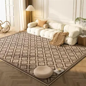 Detailed view of modern luxury living room area rug with geometric brown and beige pattern.