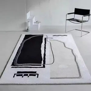 Modern abstract black and white faux cashmere area rug, perfect for living room and bedroom.