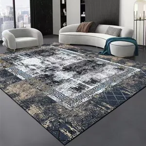 Detailed view of modern minimalist grey area rug displayed in a luxury living room.