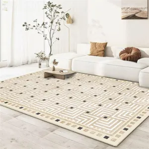 Modern geometric pattern area rug detail, large cream carpet for living room sofa and table.